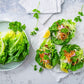 A plate of little gem lettuce next to salads made using little gem lettuce.