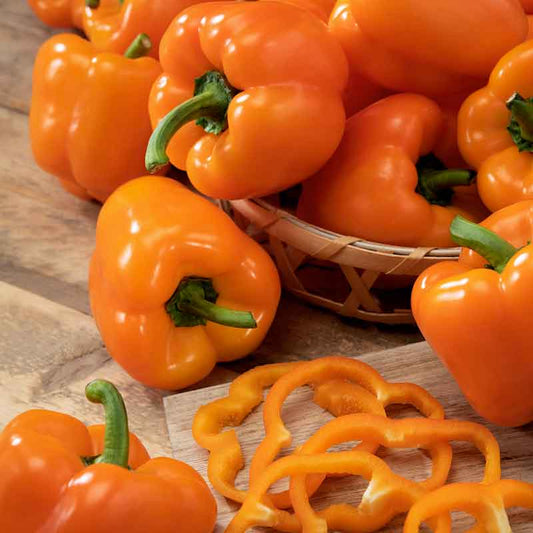 Bright Orange King bell pepper in a pile, ready for cooking. | copyright: Floramedia UK Ltd